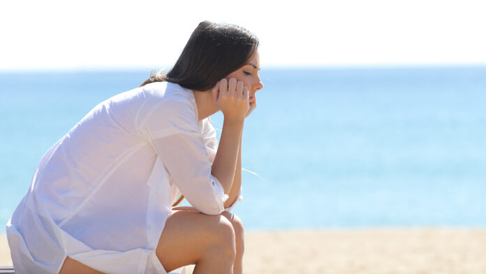 220826154032_woman_sad_sand_beach_summer_depression