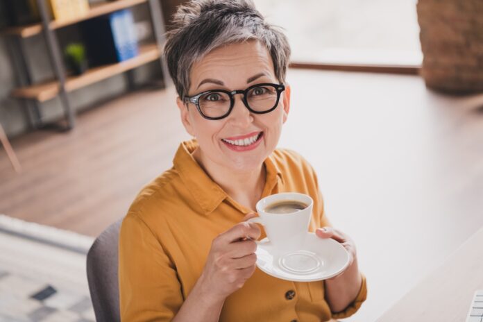 Photo,Of,Nice,Senior,Woman,Read,Coffee,Sit,Table,Dressed