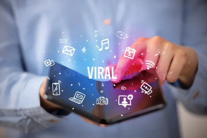 businessman-holding-foldable-smartphone-viral-inscription-social-media-concept-168442616 (1)